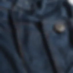 A close-up of dark blue Dickies pants showcasing the fabric and stitching details